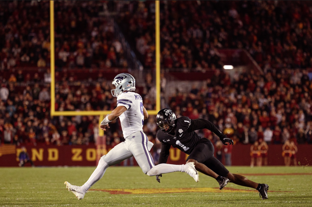 Former K-State quarterback Adrian Martinez looks to make an Iowa State defender miss in Ames during the 2022 season. 